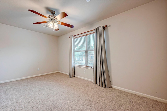 carpeted empty room with ceiling fan