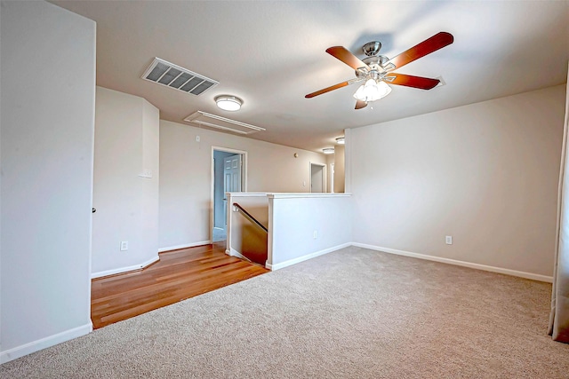 carpeted empty room with ceiling fan