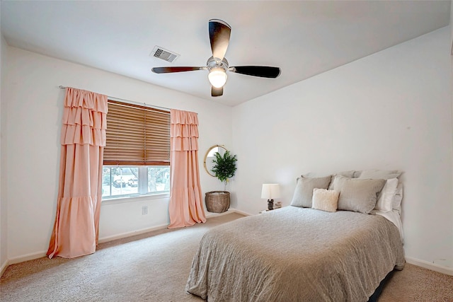 bedroom with light colored carpet and ceiling fan