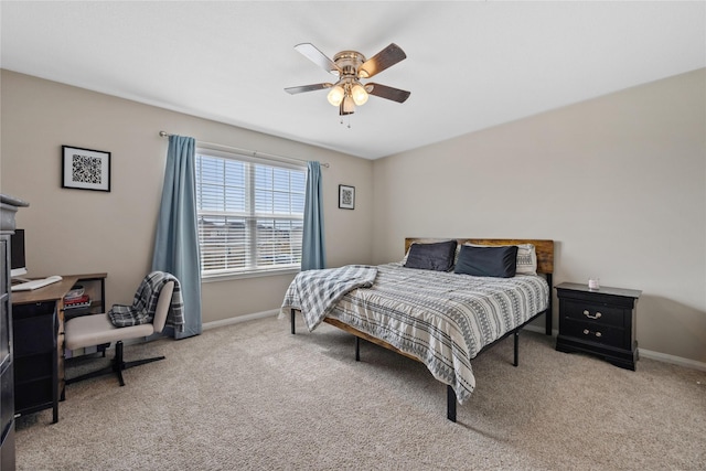 bedroom featuring carpet floors, baseboards, and a ceiling fan