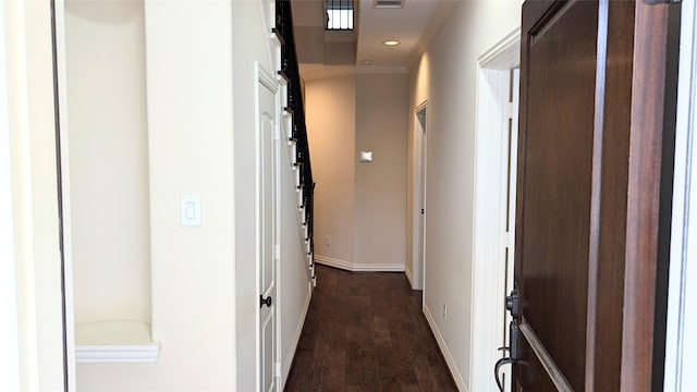 hall with recessed lighting, visible vents, dark wood finished floors, and baseboards