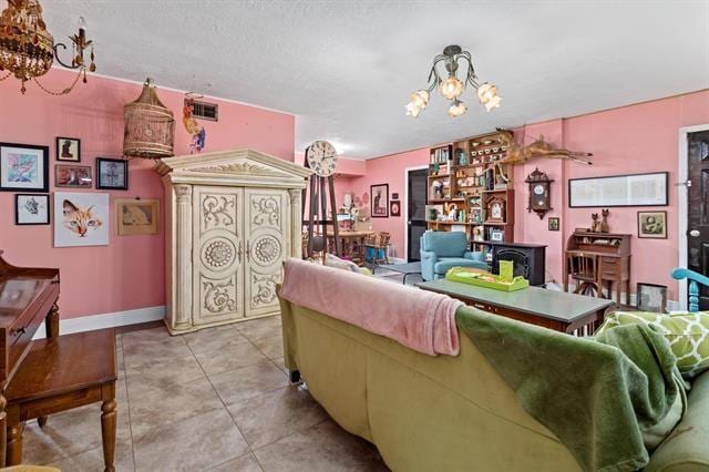 living room with light tile patterned floors and an inviting chandelier