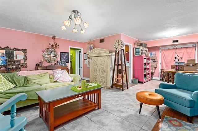 living room featuring a notable chandelier