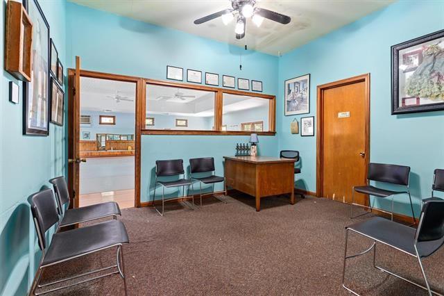 interior space with carpet and ceiling fan