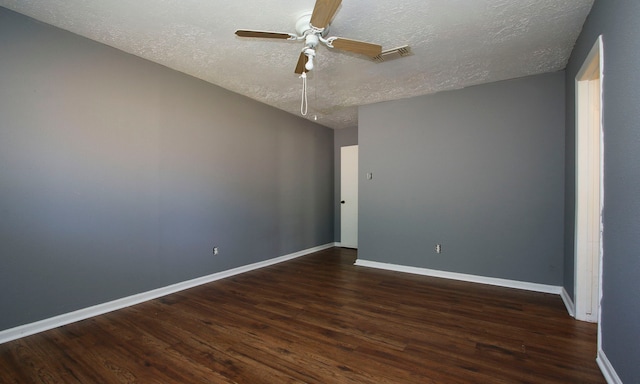 unfurnished room with ceiling fan, a textured ceiling, and dark hardwood / wood-style flooring