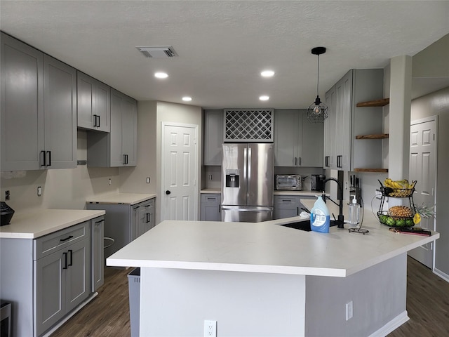 kitchen with sink, gray cabinets, stainless steel fridge with ice dispenser, and pendant lighting