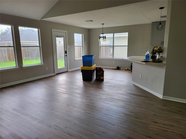 unfurnished room with dark hardwood / wood-style flooring and vaulted ceiling