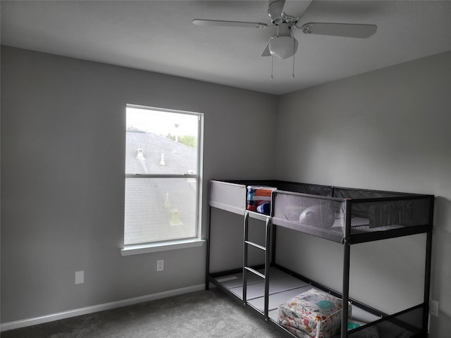 unfurnished bedroom featuring ceiling fan and carpet flooring