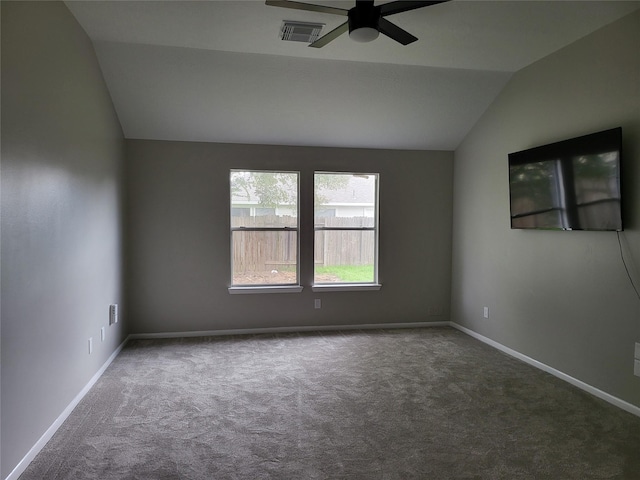 carpeted empty room with vaulted ceiling and ceiling fan