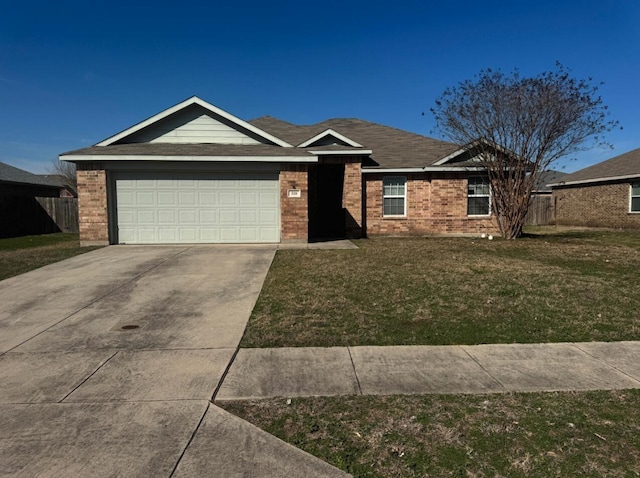 ranch-style house featuring a garage and a front yard