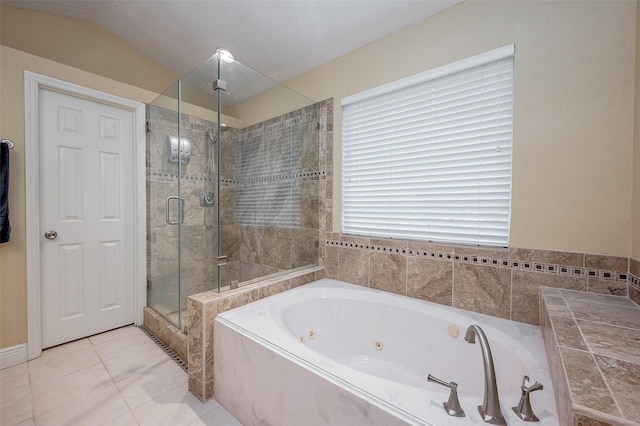 bathroom featuring tile patterned flooring and shower with separate bathtub