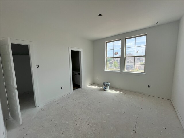 4410 Southpoint Way S, Fulshear, TX 77441 - unfurnished bedroom with a spacious closet and baseboards