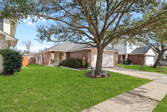 view of front of house featuring a front yard and a garage