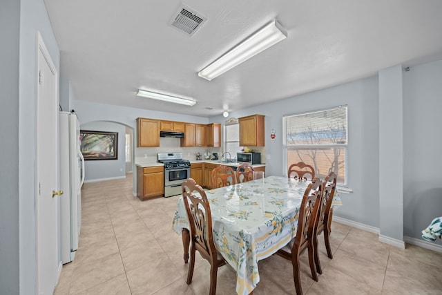 tiled dining space with sink