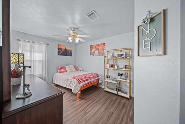 bedroom featuring ceiling fan and wood-type flooring