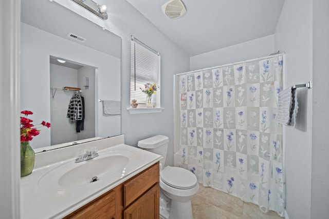 bathroom featuring vanity, a shower with curtain, tile patterned flooring, and toilet