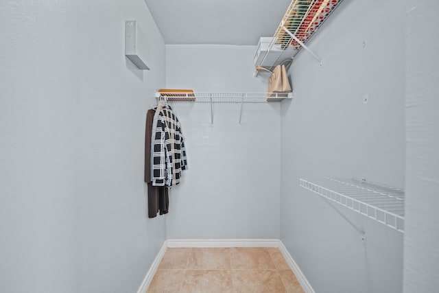 walk in closet featuring tile patterned floors