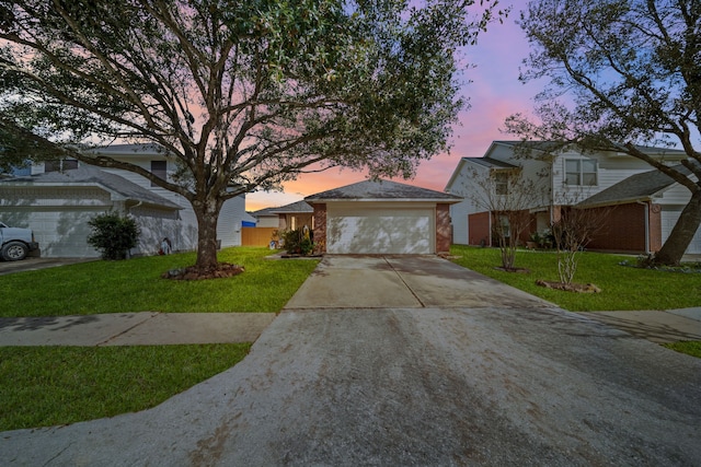 view of front facade featuring a yard and a garage