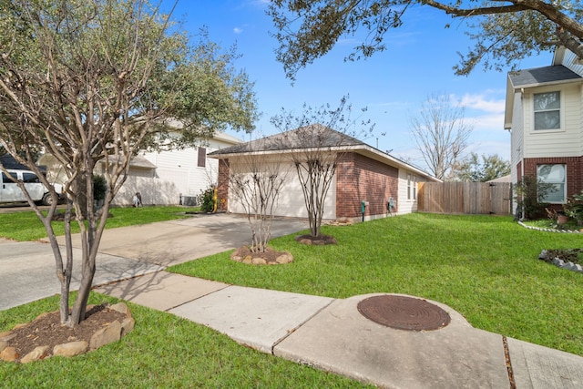 view of front facade with a front lawn and a garage