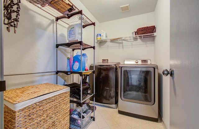 laundry room with washer and dryer