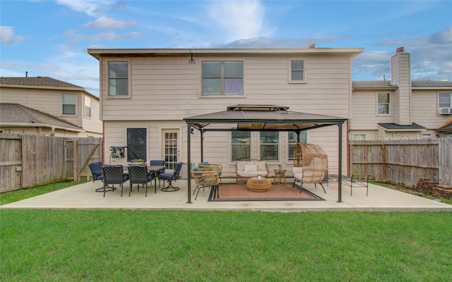 rear view of house featuring an outdoor hangout area, a yard, a gazebo, and a patio area