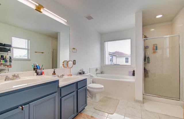 full bathroom featuring tile patterned flooring, shower with separate bathtub, vanity, and toilet