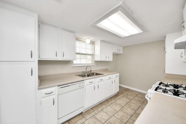 kitchen with white appliances, sink, and white cabinets