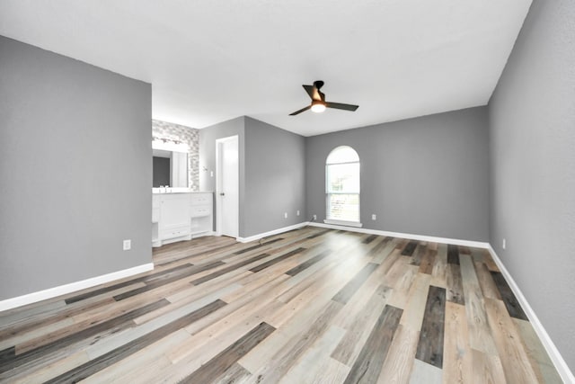 unfurnished room with hardwood / wood-style flooring and ceiling fan