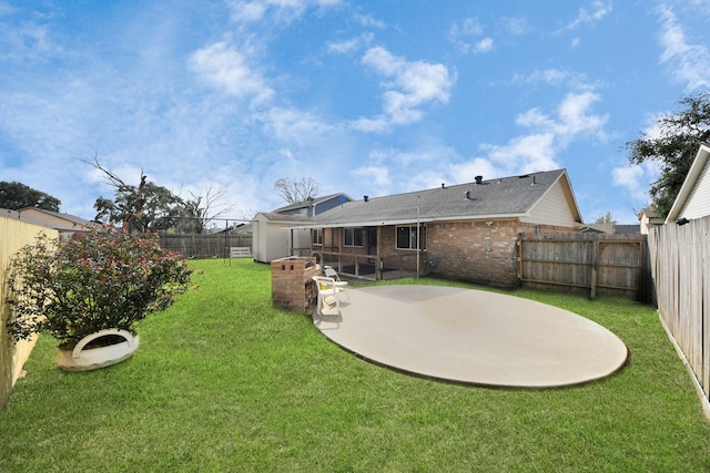 rear view of house featuring a patio area and a yard