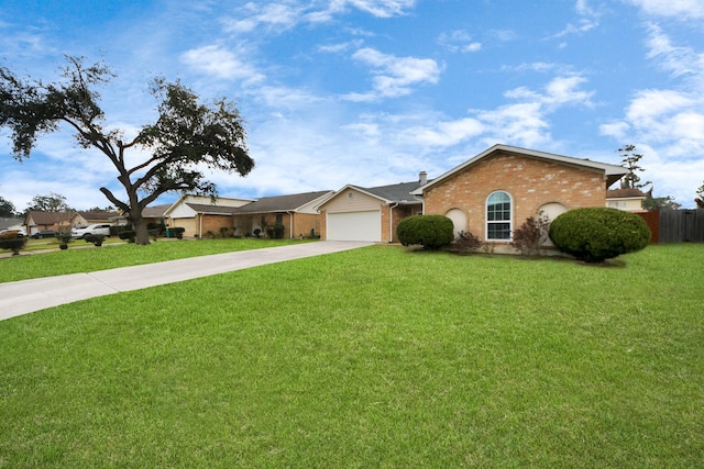 ranch-style home featuring a garage and a front yard