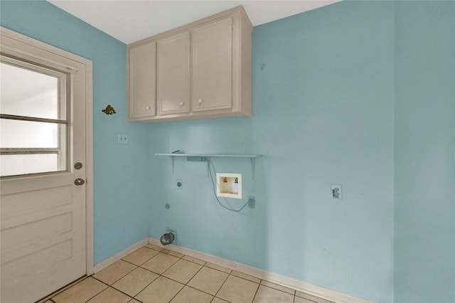 laundry area with cabinets, light tile patterned floors, hookup for an electric dryer, and hookup for a washing machine