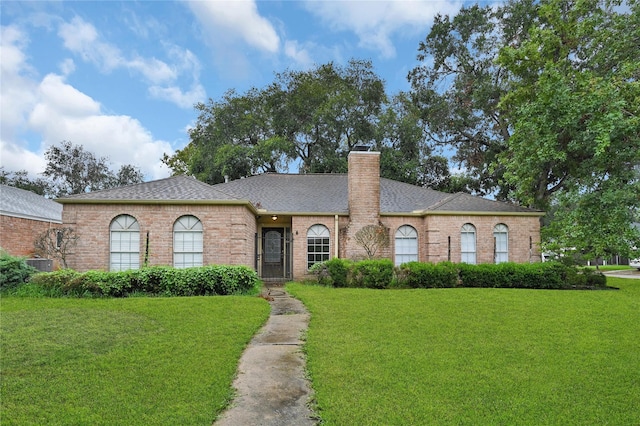 ranch-style house with a front lawn