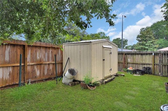 view of outbuilding featuring a yard