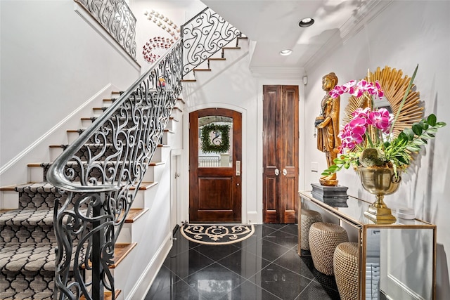 entrance foyer featuring crown molding