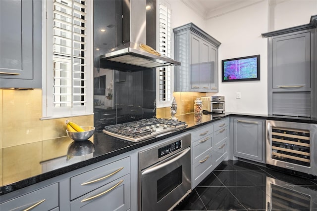 kitchen featuring wine cooler, appliances with stainless steel finishes, ventilation hood, and gray cabinets