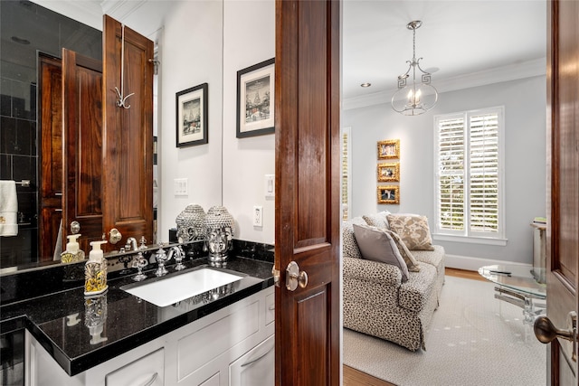 bathroom with vanity and crown molding