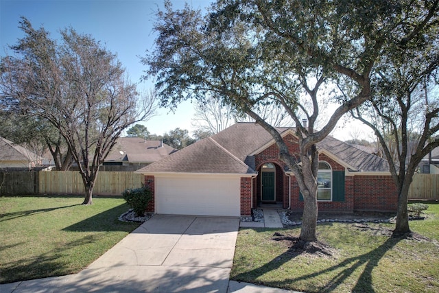 single story home with a garage and a front lawn