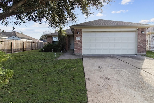 ranch-style home featuring a front lawn and a garage