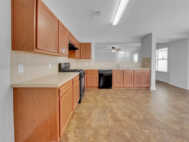 kitchen featuring black appliances, ventilation hood, sink, tasteful backsplash, and ceiling fan