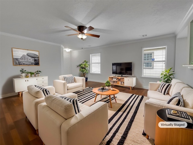 living room featuring ceiling fan, crown molding, dark wood-type flooring, and a textured ceiling