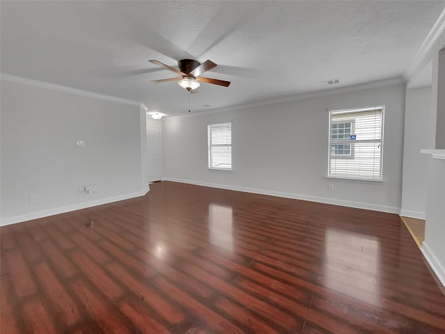 unfurnished room with crown molding, dark hardwood / wood-style flooring, a textured ceiling, and ceiling fan