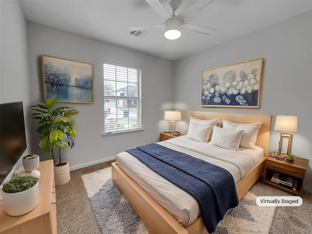 bedroom featuring ceiling fan and carpet