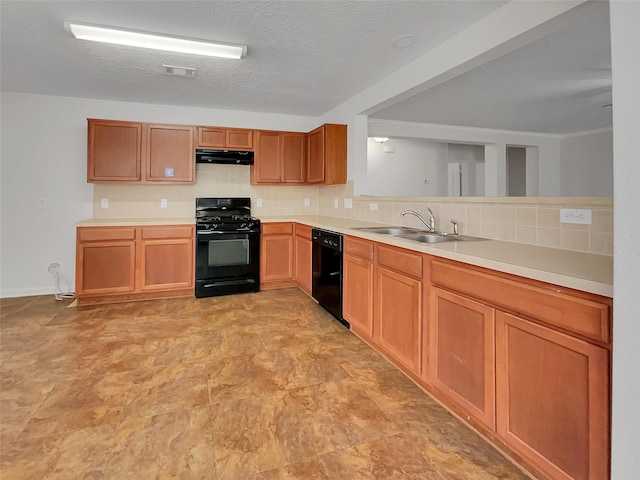 kitchen featuring sink, black appliances, a textured ceiling, and decorative backsplash