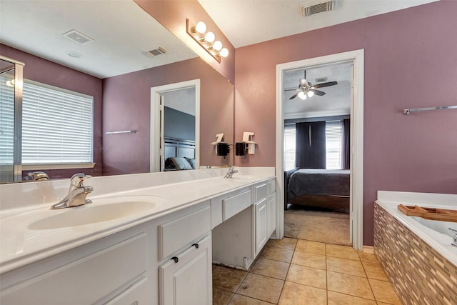 bathroom featuring ensuite bathroom, a sink, and visible vents