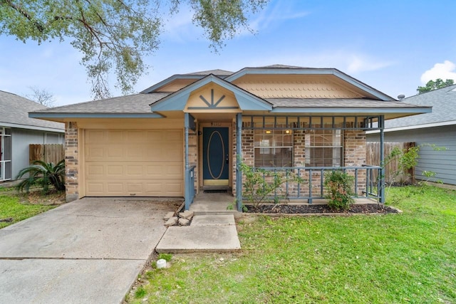 ranch-style home featuring a garage, covered porch, and a front lawn