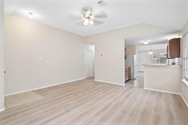 unfurnished living room featuring ceiling fan, light hardwood / wood-style flooring, and lofted ceiling