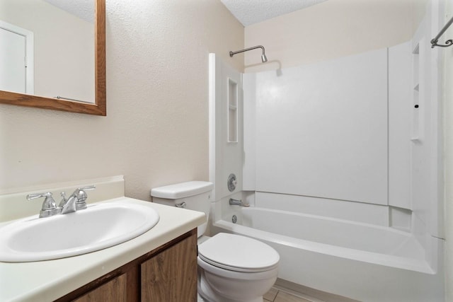 full bathroom featuring toilet, vanity, a textured ceiling, and tub / shower combination