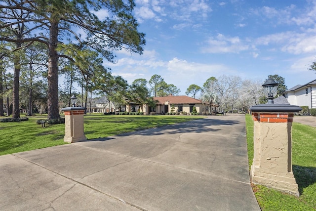 view of road featuring driveway and a residential view