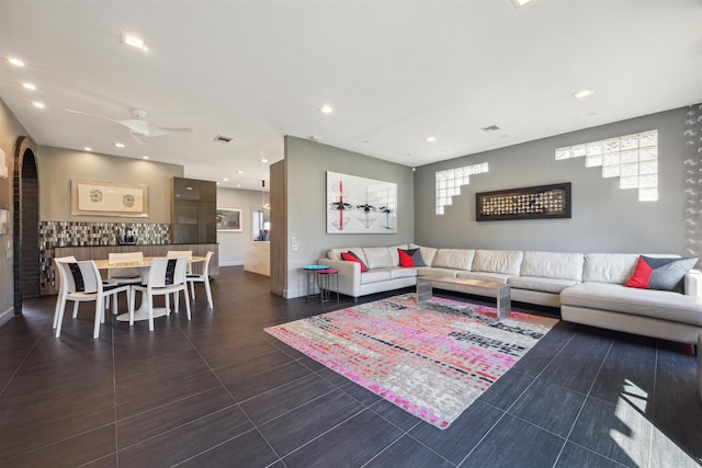 1004 Tall Pines Dr, Friendswood, TX 77546 - living area with a ceiling fan, plenty of natural light, arched walkways, and recessed lighting