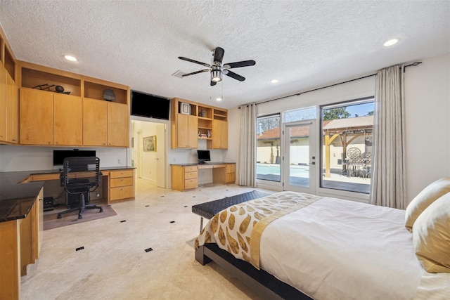 bedroom featuring a textured ceiling, access to outside, built in study area, and recessed lighting